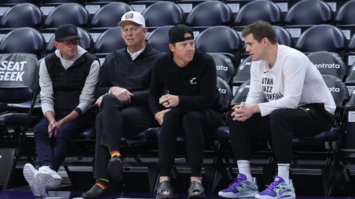 Feb 6, 2024; Salt Lake City, Utah, USA; From left to right, Utah Jazz general manager Justin Zanik, CEO Danny Ainge, owner Ryan Smith and head coach Will Hardy sit court side before the game between the Utah Jazz and the Oklahoma City Thunder at Delta Center. Mandatory Credit: Rob Gray-USA TODAY Sports