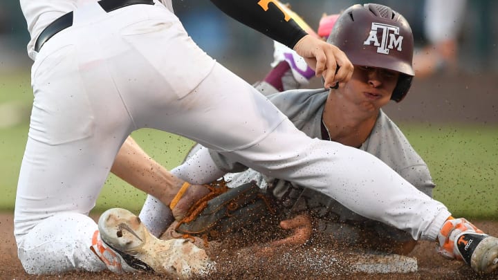 Texas A&M's Ali Camarillo (2) is tagged out at third base by Tennessee's Billy Amick (11) during a NCAA College World Series game between Tennessee and Texas A&M at Charles Schwab Field in Omaha, Neb., on Saturday, June 22, 2024. Texas A&M's Ali Camarillo (2) is tagged out at third base by Tennessee's Billy Amick (11) during a NCAA College World Series game between Tennessee and Texas A&M at Charles Schwab Field in Omaha, Neb., on Saturday, June 22, 2024.
