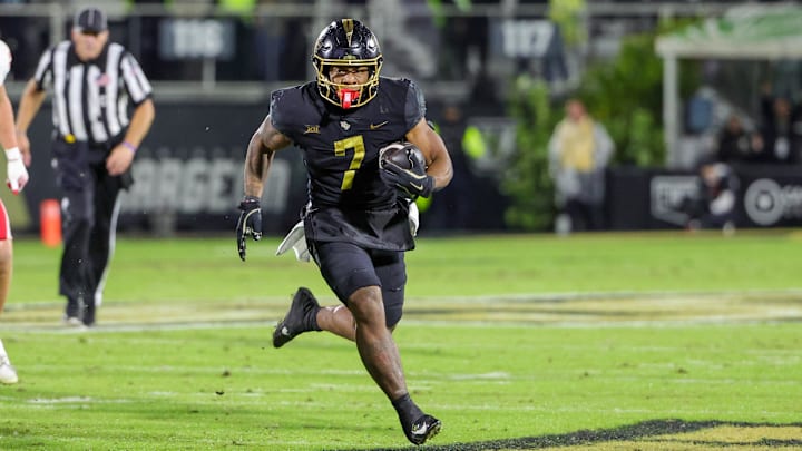Nov 29, 2024; Orlando, Florida, USA; UCF Knights running back RJ Harvey (7) runs the ball during the second quarter against the Utah Utes at FBC Mortgage Stadium. Mandatory Credit: Mike Watters-Imagn Images Nov 29, 2024; Orlando, Florida, USA; UCF Knights running back RJ Harvey (7) runs the ball during the second quarter against the Utah Utes at FBC Mortgage Stadium. Mandatory Credit: Mike Watters-Imagn Images