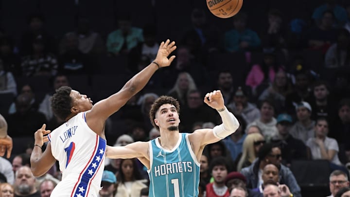 Dec 16, 2024; Charlotte, North Carolina, USA; Charlotte Hornets guard LaMelo Ball (1) and Philadelphia 76ers guard Kyle Lowry (7) go after a loose ball during the first half at the Spectrum Center. Mandatory Credit: Sam Sharpe-Imagn Images Dec 16, 2024; Charlotte, North Carolina, USA; Charlotte Hornets guard LaMelo Ball (1) and Philadelphia 76ers guard Kyle Lowry (7) go after a loose ball during the first half at the Spectrum Center. Mandatory Credit: Sam Sharpe-Imagn Images