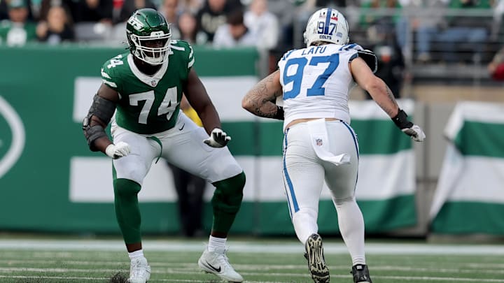 Nov 17, 2024; East Rutherford, New Jersey, USA; New York Jets offensive tackle Olu Fashanu (74) blocks against Indianapolis Colts defensive end Laiatu Latu (97) during the third quarter at MetLife Stadium. Nov 17, 2024; East Rutherford, New Jersey, USA; New York Jets offensive tackle Olu Fashanu (74) blocks against Indianapolis Colts defensive end Laiatu Latu (97) during the third quarter at MetLife Stadium.