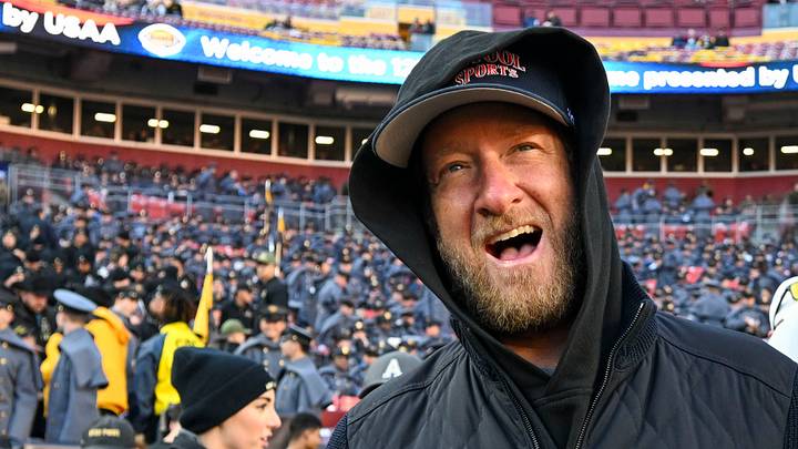 Dec 14, 2024; Landover, Maryland, USA;   Dave Portnoy, Bar Stool Sports  founder and owner  walks along the sidelines before the playing of the 125 Army Navy game at Commanders Field. Mandatory Credit: Tommy Gilligan-Imagn ImagesDec 14, 2024; Landover, Maryland, USA;  Dave Portnoy poses with solders before the between the Army Black Knights and the Navy Midshipmen  at Commanders Field. Mandatory Credit: Tommy Gilligan-Imagn Images