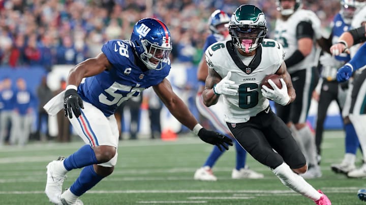 Oct 9, 2025; East Rutherford, New Jersey, USA; Philadelphia Eagles wide receiver DeVonta Smith (6) carries the ball defended by New York Giants linebacker Bobby Okereke (58) during the first quarter of the game at MetLife Stadium. Mandatory Credit: Vincent Carchietta-Imagn Images Oct 9, 2025; East Rutherford, New Jersey, USA; Philadelphia Eagles wide receiver DeVonta Smith (6) carries the ball defended by New York Giants linebacker Bobby Okereke (58) during the first quarter of the game at MetLife Stadium. Mandatory Credit: Vincent Carchietta-Imagn Images