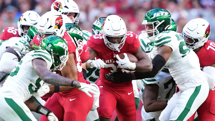 Nov 10, 2024; Glendale, Arizona, USA; Arizona Cardinals running back Trey Benson (33) runs against the New York Jets during the first half at State Farm Stadium. Mandatory Credit: Joe Camporeale-Imagn Images
