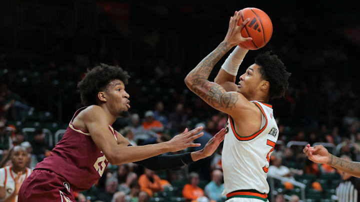 Jan 8, 2025; Coral Gables, Florida, USA; Miami Hurricanes guard Jalil Bethea (3) drives to the basket against Florida State Seminoles guard Justin Thomas (25) during the second half at Watsco Center. Mandatory Credit: Sam Navarro-Imagn Images Jan 8, 2025; Coral Gables, Florida, USA; Miami Hurricanes guard Jalil Bethea (3) drives to the basket against Florida State Seminoles guard Justin Thomas (25) during the second half at Watsco Center. Mandatory Credit: Sam Navarro-Imagn Images