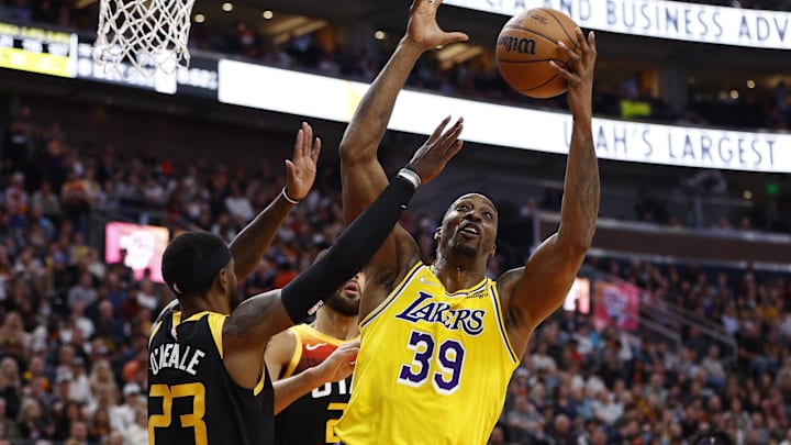 Mar 31, 2022; Salt Lake City, Utah, USA; Los Angeles Lakers center Dwight Howard (39) grabs a rebound against Utah Jazz forward Royce O'Neale (23) in the second quarter at Vivint Arena. Mandatory Credit: Jeffrey Swinger-Imagn Images Mar 31, 2022; Salt Lake City, Utah, USA; Los Angeles Lakers center Dwight Howard (39) grabs a rebound against Utah Jazz forward Royce O'Neale (23) in the second quarter at Vivint Arena. Mandatory Credit: Jeffrey Swinger-Imagn Images