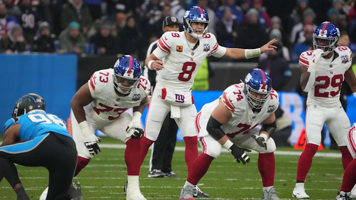 Nov 10, 2024; Munich, Germany; New York Giants quarterback Daniel Jones (8) prepares to take the snap against the Carolina Panthers in the first half during the 2024 NFL Munich Game at Allianz Arena. Nov 10, 2024; Munich, Germany; New York Giants quarterback Daniel Jones (8) prepares to take the snap against the Carolina Panthers in the first half during the 2024 NFL Munich Game at Allianz Arena.