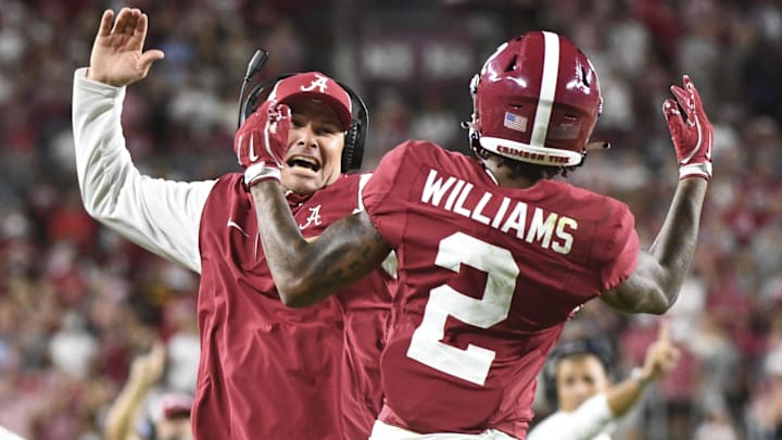 Sep 7, 2024; Tuscaloosa, Alabama, USA;  Alabama Crimson Tide wide receiver Ryan Williams (2) celebrates an assistant coach after scoring a touchdown agains the South Florida Bulls at Bryant-Denny Stadium. Alabama won 42-16. Mandatory Credit: Gary Cosby Jr.-Imagn Images