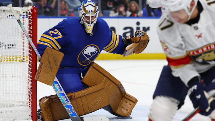 Oct 12, 2024; Buffalo, New York, USA;  Buffalo Sabres goaltender Devon Levi (27) looks for the puck during the third period against the Florida Panthers at KeyBank Center. Mandatory Credit: Timothy T. Ludwig-Imagn Images