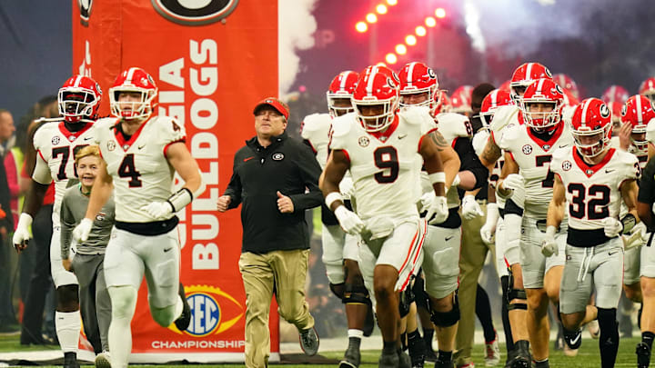 Dec 2, 2023; Atlanta, GA, USA; Georgia Bulldogs head coach Kirby Smart runs out of the tunnel with his team before the SEC Championship game against the Alabama Crimson Tide at Mercedes-Benz Stadium. Mandatory Credit: John David Mercer-Imagn Images Dec 2, 2023; Atlanta, GA, USA; Georgia Bulldogs head coach Kirby Smart runs out of the tunnel with his team before the SEC Championship game against the Alabama Crimson Tide at Mercedes-Benz Stadium. Mandatory Credit: John David Mercer-Imagn Images