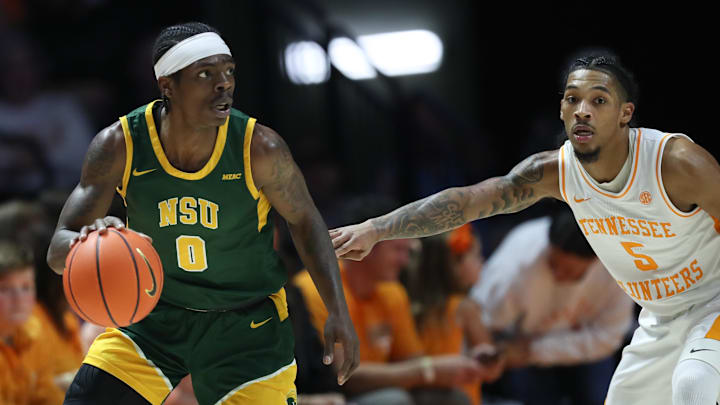 Dec 31, 2024; Knoxville, Tennessee, USA; Norfolk State Spartans guard Christian Ings (0) moves the ball against Tennessee Volunteers guard Zakai Zeigler (5) during the first half at Thompson-Boling Arena at Food City Center. Mandatory Credit: Randy Sartin-Imagn Images
