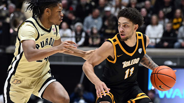 Toledo Rockets guard Sam Lewis (11) looks to make a move on Purdue guard Gicarri Harris.