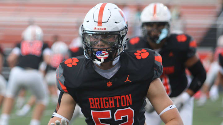 Offensive lineman Jack Carlson of Brighton warms up before a season-opening football game against Dexter on Thursday, Aug. 28, 2025 at Brighton.