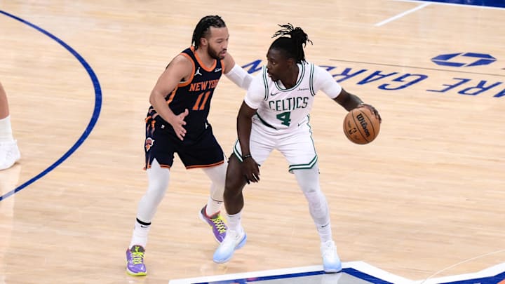 Apr 8, 2025; New York, New York, USA; Boston Celtics guard Jrue Holiday (4) sets the play while being defended by New York Knicks guard Jalen Brunson (11) during the first half at Madison Square Garden. Mandatory Credit: John Jones-Imagn Images