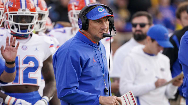 Nov 20, 2021; Columbia, Missouri, USA; Florida Gators head coach Dan Mullen watches play against the Missouri Tigers during the first half at Faurot Field at Memorial Stadium. Mandatory Credit: Denny Medley-Imagn Images