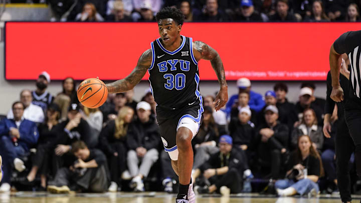 Feb 24, 2026; Provo, Utah, USA; BYU Cougars forward Kennard Davis Jr. (30) dribbles the ball during the first half against the UCF Knights at Marriott Center. Mandatory Credit: Aaron Baker-Imagn Images Feb 24, 2026; Provo, Utah, USA; BYU Cougars forward Kennard Davis Jr. (30) dribbles the ball during the first half against the UCF Knights at Marriott Center. Mandatory Credit: Aaron Baker-Imagn Images