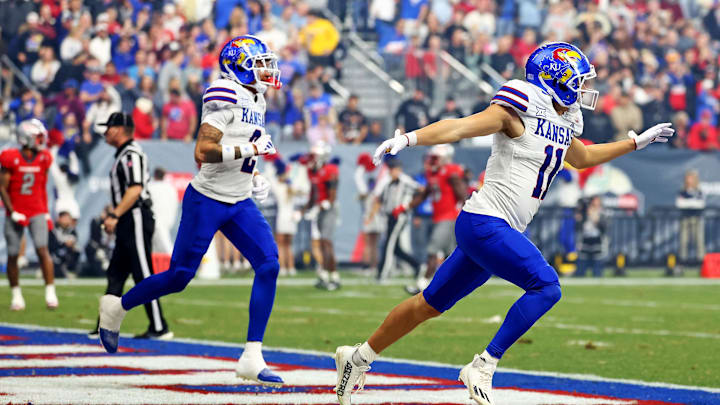 Dec 26, 2023; Phoenix, AZ, USA; Kansas Jayhawks wide receiver Luke Grimm (11) celebrates after scoring a touchdown in the Guaranteed Rate Bowl