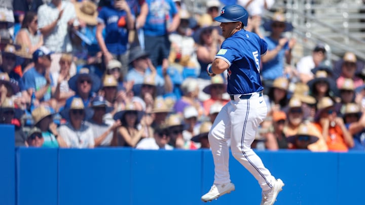 Mar 13, 2025:  Toronto Blue Jays outfielder Daulton Varsho (5) celebrates after hitting a two run home run against the Baltimore Orioles in the fifth inning during spring training at TD Ballpark. 