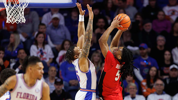 Jan 25, 2025; Gainesville, Florida, USA; Georgia Bulldogs guard Silas Demary Jr. (5) shoots over Florida Gators guard Alijah Martin (15) during the second half at Exactech Arena at the Stephen C. O'Connell Center. Mandatory Credit: Matt Pendleton-Imagn Images