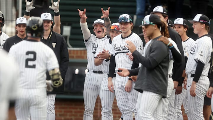Vanderbilt baseball players celebrate the game-winning home run by Vanderbilt's Logan Johnstone (2) during their game against Marist at Vanderbilt’s Hawkins Field Friday, Feb. 20, 2026.