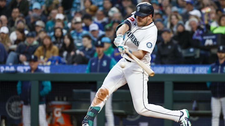 Seattle Mariners outfielder Luke Raley hits a double during a game against the Texas Rangers on April 12 at T-Mobile Park.