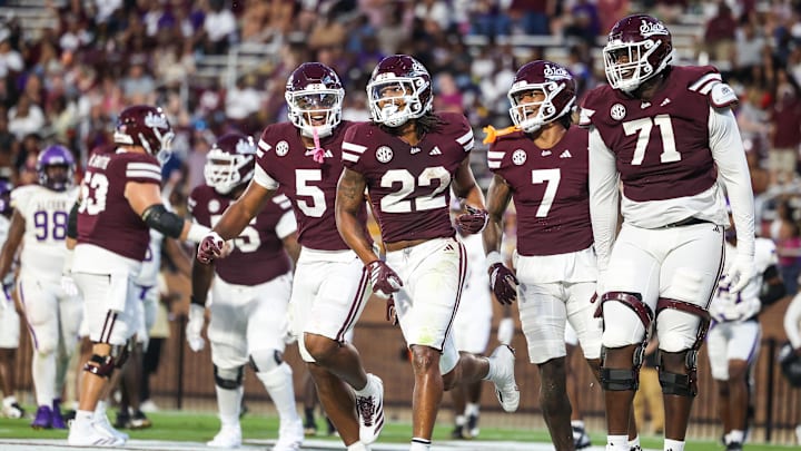 Sep 13, 2025; Starkville, Mississippi, USA; Mississippi State Bulldogs running back Xavier Gayten (22) celebrates with tight end Max Reese (5), wide receiver Markus Allen (7), and offensive lineman Saquon Miles (71) after a touchdown against the Alcorn State Braves during the second half at Davis Wade Stadium at Scott Field. Mandatory Credit: Wesley Hale-Imagn Images