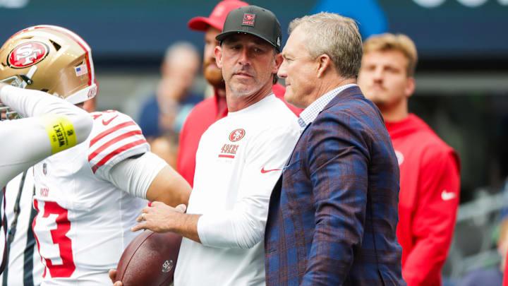 Sep 7, 2025; Seattle, Washington, USA; San Francisco 49ers general manager John Lynch, right, talks with head coach Kyle Shanahan during pregame warmups against the Seattle Seahawks at Lumen Field. Mandatory Credit: Joe Nicholson-Imagn Images