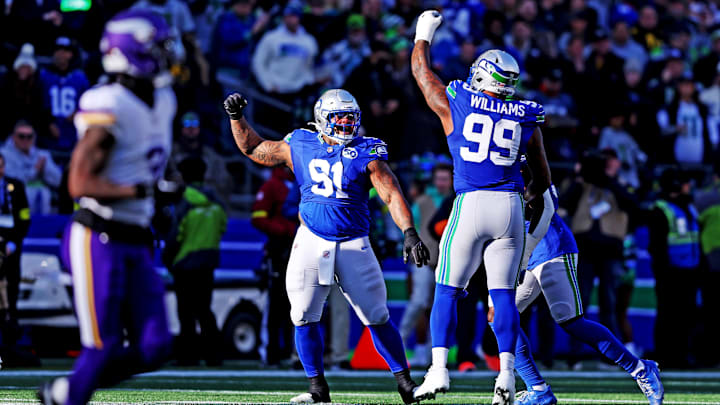 Nov 30, 2025; Seattle, Washington, USA; Seattle Seahawks defensive end Leonard Williams (99) celebrates after a play during the first half against the Minnesota Vikings at Lumen Field. Mandatory Credit: Kevin Ng-Imagn Images