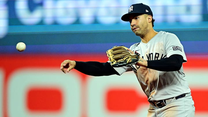 Oct 19, 2024; Cleveland, Ohio, USA; New York Yankees second base Gleyber Torres (25) throws to first base for an out during the third inning against the Cleveland Guardians during game five of the ALCS for the 2024 MLB playoffs at Progressive Field. Mandatory Credit: David Dermer-Imagn Images