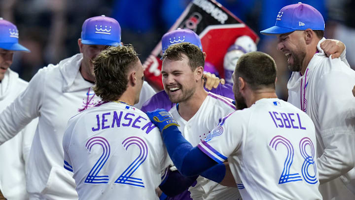 Apr 26, 2026; Kansas City, Missouri, USA; Kansas City Royals center fielder Lane Thomas (15) celebrates with teammates after hitting a walk-off home run during the tenth inning against the Los Angeles Angels at Kauffman Stadium. Mandatory Credit: Jay Biggerstaff-Imagn Images