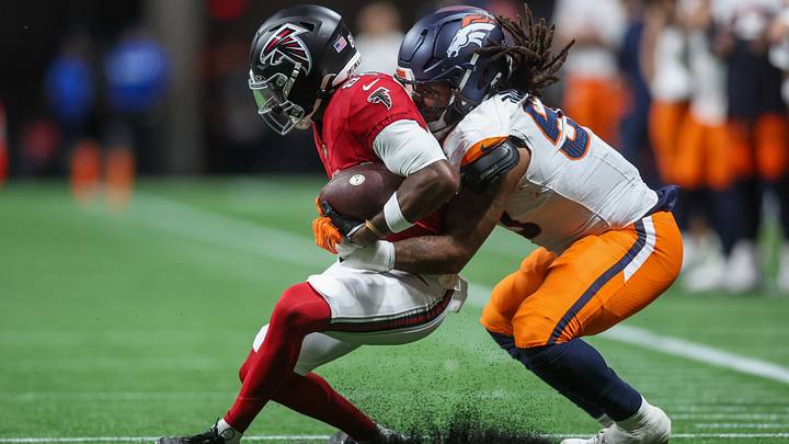 Aug 14, 2026; Atlanta, Georgia, USA; Atlanta Falcons wide receiver Keelan Marion (85) is tackled by Denver Broncos linebacker Red Murdock (50) in the second quater at Mercedes-Benz Stadium. Mandatory Credit: Brett Davis-Imagn Images