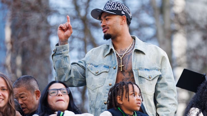 Feb 11, 2026; Seattle, WA, USA;  Seattle Seahawks wide receiver Jaxon Smith-Njigba (11) reacts during the Super Bowl LX parade. Mandatory Credit: Kevin Ng-Imagn Images