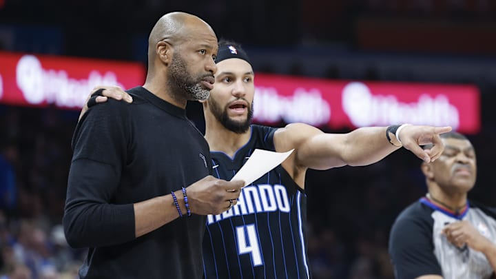 Jan 13, 2024; Oklahoma City, Oklahoma, USA; Orlando Magic guard Jalen Suggs (4) talks to head coach Jamahl Mosley during the second quarter at Paycom Center. Mandatory Credit: Alonzo Adams-Imagn Images