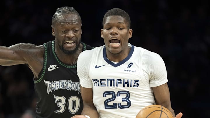 Mar 3, 2026; Minneapolis, Minnesota, USA; Memphis Grizzlies forward Cedric Coward (23) dribbles the ball past Minnesota Timberwolves forward Julius Randle (30) in the first half at Target Center. Mandatory Credit: Jesse Johnson-Imagn Images Mar 3, 2026; Minneapolis, Minnesota, USA; Memphis Grizzlies forward Cedric Coward (23) dribbles the ball past Minnesota Timberwolves forward Julius Randle (30) in the first half at Target Center. Mandatory Credit: Jesse Johnson-Imagn Images