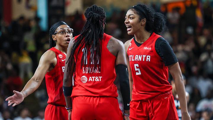 May 24, 2026; College Park, Georgia, USA; Atlanta Dream guard Allisha Gray (15) and guard Rhyne Howard (10), and forward Angel Reese (5) celebrate a three point shot against the Phoenix Mercury during the fourth quarter at Gateway Center Arena at College Park. Mandatory Credit: Jordan Godfree-Imagn Images