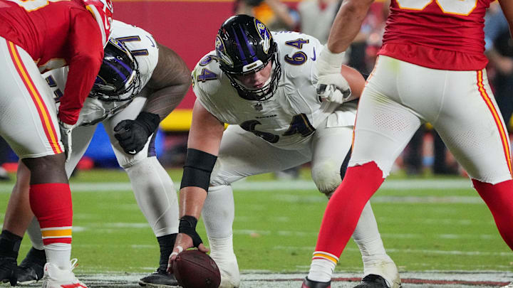 Sep 5, 2024; Kansas City, Missouri, USA; Baltimore Ravens center Tyler Linderbaum (64) at the line of scrimmage against the Kansas City Chiefs during the game at GEHA Field at Arrowhead Stadium. Mandatory Credit: Denny Medley-Imagn Images