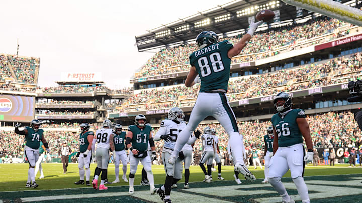 Dec 14, 2025; Philadelphia, Pennsylvania, USA; Philadelphia Eagles tight end Dallas Goedert (88) and linebacker Jalyx Hunt (58) celebrate after scoring a touchdown in the first quarter against the Las Vegas Raiders at Lincoln Financial Field. Mandatory Credit: Bill Streicher-Imagn Images