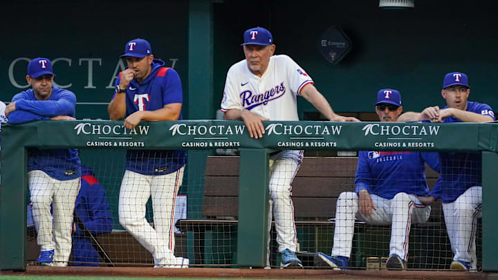 Arlington, Texas, USA; Texas Rangers manager Bruce Bochy (15) looks on from the dugout during the second inning of a game against the Colorado Rockies at Globe Life Field.