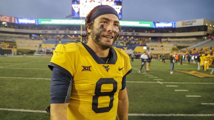 Sep 23, 2023; Morgantown, West Virginia, USA; West Virginia Mountaineers quarterback Nicco Marchiol (8) celebrates after defeating the Texas Tech Red Raiders at Mountaineer Field at Milan Puskar Stadium. Mandatory Credit: Ben Queen-Imagn Images