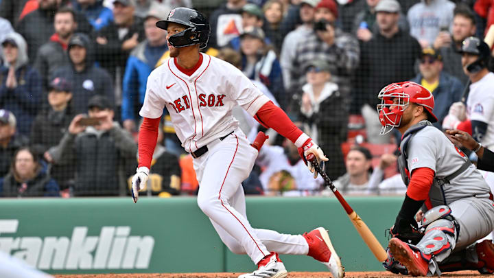 Apr 6, 2025; Boston, Massachusetts, USA; Boston Red Sox center fielder Kristian Campbell (28) hits an RBI single during the ninth inning against the St. Louis Cardinalsat Fenway Park. Mandatory Credit: Eric Canha-Imagn Images