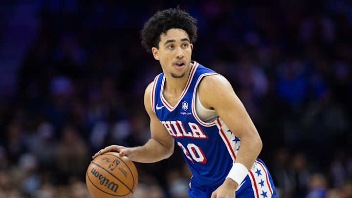 Dec 4, 2024; Philadelphia, Pennsylvania, USA; Philadelphia 76ers guard Jared McCain (20) controls the ball against the Orlando Magic during the fourth quarter at Wells Fargo Center. Mandatory Credit: Bill Streicher-Imagn Images