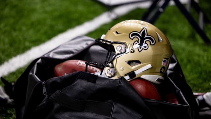 Nov 5, 2023; New Orleans, Louisiana, USA; Detailed view of the New Orleans Saints helmet and ball bag against the Chicago Bears during the first half at the Caesars Superdome. Mandatory Credit: Stephen Lew-Imagn Images Nov 5, 2023; New Orleans, Louisiana, USA; Detailed view of the New Orleans Saints helmet and ball bag against the Chicago Bears during the first half at the Caesars Superdome. Mandatory Credit: Stephen Lew-Imagn Images