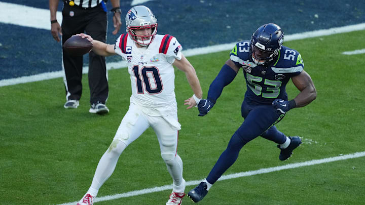 Feb 8, 2026; Santa Clara, CA, USA;  New England Patriots quarterback Drake Maye (10) is pressured by Seattle Seahawks linebacker Boye Mafe (53) in the first half in Super Bowl LX at Levi's Stadium. Mandatory Credit: Kirby Lee-Imagn Images