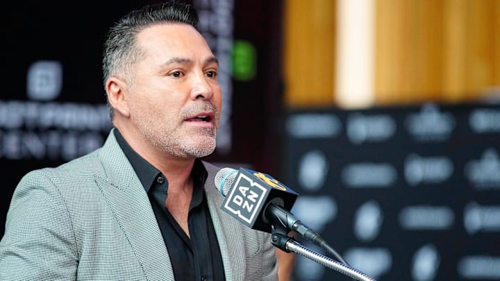 Jan. 25, 2024; Phoenix, Ariz; USA; Oscar De La Hoya speaks about boxer Jamie Munguia (center) about the Munguia v Ryder main event during a press conference for Golden Boy boxing event.