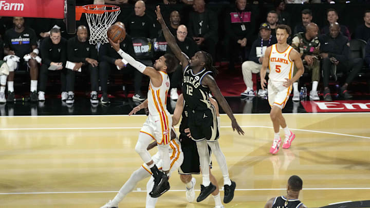 Dec 14, 2024; Las Vegas, Nevada, USA; Atlanta Hawks guard Trae Young (11) shoots against Milwaukee Bucks forward Taurean Prince (12) during the second half in a semifinal of the 2024 Emirates NBA Cup at T-Mobile Arena. Mandatory Credit: Kyle Terada-Imagn Images Dec 14, 2024; Las Vegas, Nevada, USA; Atlanta Hawks guard Trae Young (11) shoots against Milwaukee Bucks forward Taurean Prince (12) during the second half in a semifinal of the 2024 Emirates NBA Cup at T-Mobile Arena. Mandatory Credit: Kyle Terada-Imagn Images