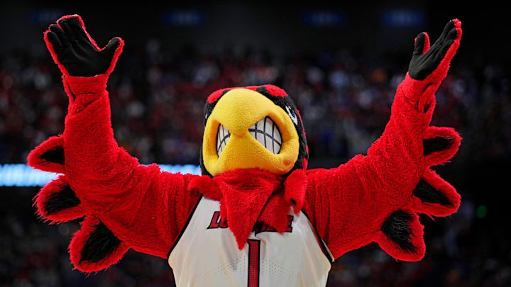 Mar 20, 2025; Lexington, KY, USA; The Louisville Cardinals mascot cheers during the second half against the Creighton Bluejays in the first round of the NCAA Tournament at Rupp Arena. Mandatory Credit: Aaron Doster-Imagn Images