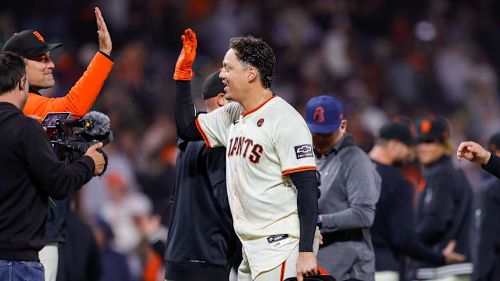 Jun 24, 2024; San Francisco, California, USA; San Francisco Giants first base Wilmer Flores is congratulated by teammates after the game against the Chicago Cubs at Oracle Park. All Giants players wore the number 24 in honor of Giants former player Willie Mays. Jun 24, 2024; San Francisco, California, USA; San Francisco Giants first base Wilmer Flores is congratulated by teammates after the game against the Chicago Cubs at Oracle Park. All Giants players wore the number 24 in honor of Giants former player Willie Mays.