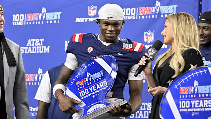 Jan 30, 2025; Arlington, TX, USA; East running back Jacory Croskey-Merritt of Arizona (31) is presented with the offensive MVP trophy after the East defeats the West in the East-West Shrine Bowl at AT&T Stadium.  