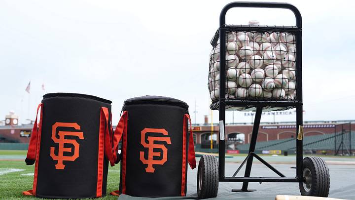 Ball bags with the San Francisco Giants logo sit on the field with a ball cart before the game. Credit: Darren Yamashita-Imagn Images Ball bags with the San Francisco Giants logo sit on the field with a ball cart before the game. Credit: Darren Yamashita-Imagn Images