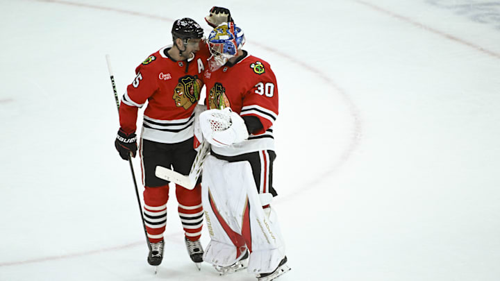 Mar 3, 2025; Chicago, Illinois, USA;  Chicago Blackhawks defenseman Alec Martinez (25) hugs goaltender Spencer Knight after the third period against the Los Angeles Kings  at the United Center. Mandatory Credit: Matt Marton-Imagn Images